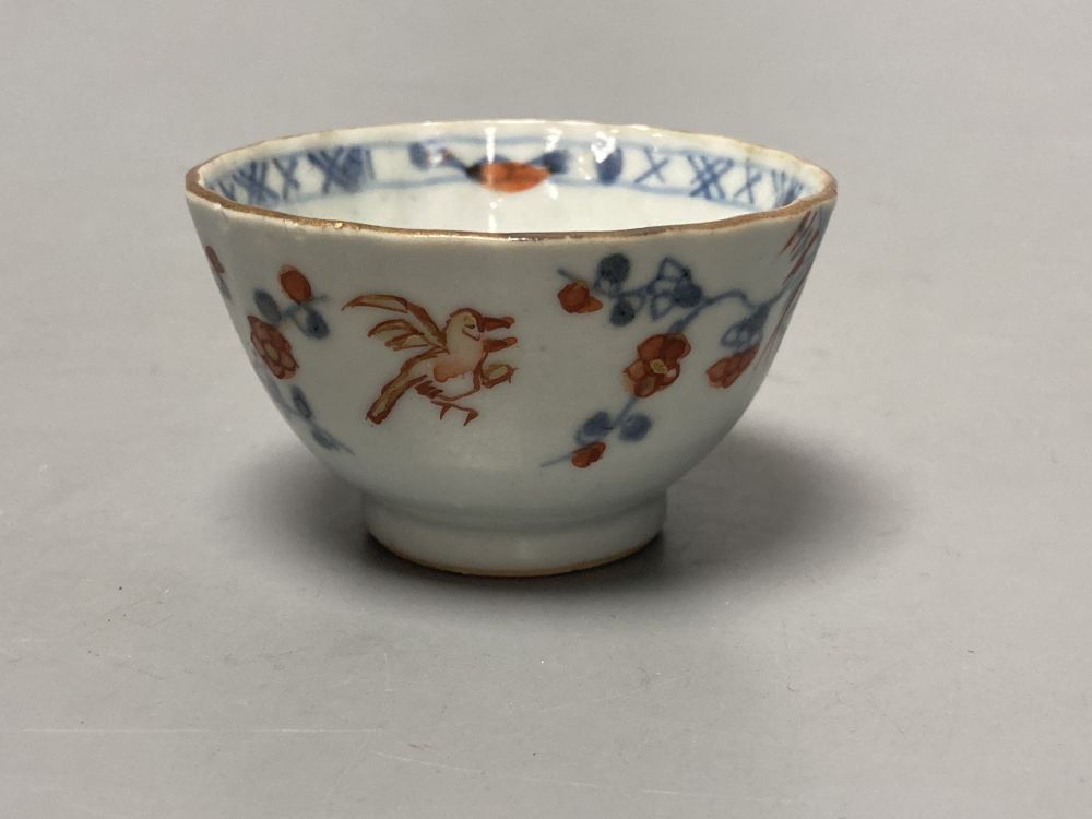 An 18th century Chinese famille rose bowl, 11.5cm diameter, and three smaller Chinese porcelain bowls